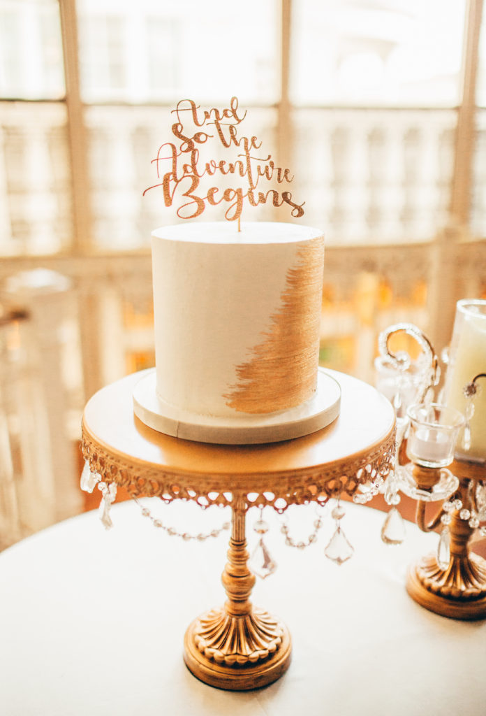 gold painted cutting cake