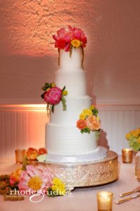 orange flowers wedding cake