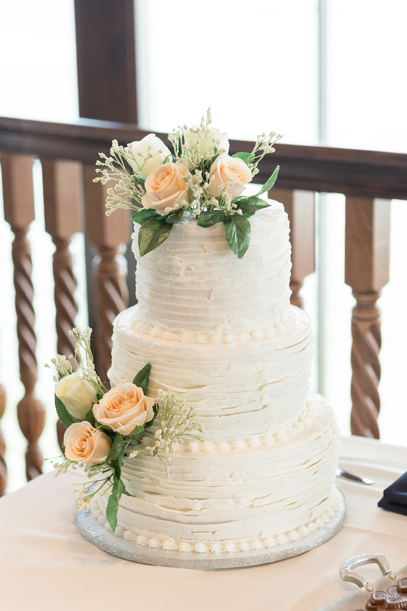 ruffled white wedding cake